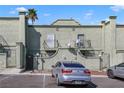 Back side of building featuring balconies and permit parking at 7054 Burcot Ave # G40, Las Vegas, NV 89156