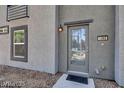 Welcoming front entrance with a stylish modern door, updated paint and clear house number at 9050 W Tropicana Ave # 1009, Las Vegas, NV 89147
