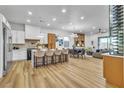 Spacious open-concept kitchen and dining area with modern appliances and ample seating at 154 Nine Mile Creek Dr, Las Vegas, NV 89138