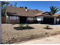 Inviting single-story home with a gravel yard, dark accents, and a well-maintained landscape at 3409 El Cortez Ave, Las Vegas, NV 89102