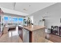 Kitchen featuring an island with a sink and a window with a city view in the background at 4471 Dean Martin Dr # 2204, Las Vegas, NV 89103
