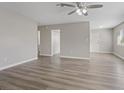Bright living room featuring sleek flooring, neutral paint, and a modern ceiling fan at 4562 Scott Ave, Las Vegas, NV 89102