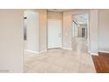 Inviting home entryway with ceramic tile, and a white front door at 5505 Criollo Dr, Las Vegas, NV 89122