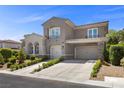 Charming home with well-kept yard and a two-car garage with stone accents at 631 Coriander Canyon Ct, Las Vegas, NV 89138