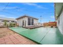 Spacious backyard featuring a large patio area and a detached room, perfect for outdoor entertaining at 6508 Bourbon Way, Las Vegas, NV 89107