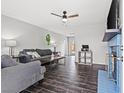 Inviting living room with modern furniture, ceiling fan, and decorative fireplace at 6508 Bourbon Way, Las Vegas, NV 89107