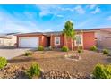 Charming single-story home with desert landscaping and a spacious two-car garage at 6661 Gallup Ct, Pahrump, NV 89060