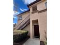 Condo exterior featuring a two-story facade, walkway, and private entry at 8501 W University Ave # 1128, Las Vegas, NV 89147