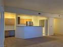 Inviting living space adjacent to a modern kitchen, featuring integrated desk at 8555 W Russell Rd # 1078, Las Vegas, NV 89113