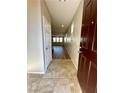 Inviting entryway with tile flooring, leading to an open-concept living area at 9136 Cocowoods Pl, Las Vegas, NV 89148