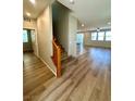 Spacious living room features wood flooring, natural light, and an open floor plan at 9136 Cocowoods Pl, Las Vegas, NV 89148