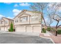 Inviting townhouse featuring a neutral color scheme, attached garages and well maintained landscaping at 9315 Indian Corn Ct # 101, Las Vegas, NV 89178
