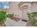 Inviting front entrance with a well maintained walkway and desert landscaping at 9315 Indian Corn Ct # 101, Las Vegas, NV 89178