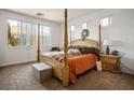Bright bedroom features a four-poster bed, neutral walls, and large windows offering plenty of natural light at 948 Mill Run Creek Ave, Henderson, NV 89002