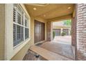 Welcoming entrance featuring double doors, brick accents, and a covered porch at 9733 Camden Hills Ave, Las Vegas, NV 89145