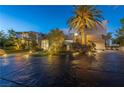 Stunning home with landscape lighting, a circular driveway, and a meticulously designed front yard at 1108 Pine Island Ct, Las Vegas, NV 89134