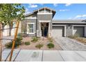 Well-manicured home featuring a lovely landscaped front yard and inviting curb appeal at 1174 King Lark St, Henderson, NV 89011