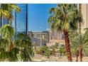 View of city buildings and palm trees at 145 E Harmon Ave # 201, Las Vegas, NV 89109