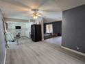 View of the kitchen with white cabinets, appliances, and light-colored vinyl flooring at 2501 Capistrano Ave, Las Vegas, NV 89121