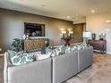 Comfortable living room with contemporary furnishings and decor for a modern feel at 2674 Duneville St, Las Vegas, NV 89146