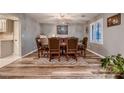 Formal dining room boasts wood floors, decorative chandelier and seating for eight at 2721 Family Ct, Las Vegas, NV 89117