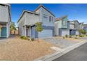 Contemporary two-story home with a two-car garage, complemented by low-maintenance desert landscaping at 3736 Paseo De Paz Ave, Las Vegas, NV 89115