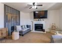 Cozy living room with fireplace, neutral tones, and decorative accents at 436 Emden St, Henderson, NV 89015