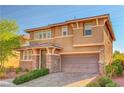 Charming two-story home with neutral paint, stone accents, a two-car garage, and manicured landscaping at 5662 Escamilla Rd, Las Vegas, NV 89135