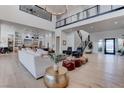 Expansive living room featuring hardwood floors, a modern staircase, and stylish furnishings at 6265 Iron Mountain Rd, Las Vegas, NV 89131