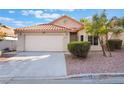 Charming single-story home with a two-car garage and desert landscaping for easy care at 8113 Dolphin Landing Dr, Las Vegas, NV 89128