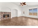 Inviting living room with tiled floors, fireplace, and ample natural light at 820 Wintersweet Rd, Henderson, NV 89015