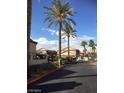 Community entrance featuring palm trees and an access gate for residents at 8410 Eldora Ave # 2067, Las Vegas, NV 89117