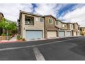 Modern townhome with a two-car garage and neutral color palette at 965 Nevada State Dr # 24201, Henderson, NV 89002