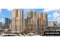 Daytime exterior of the MGM Signature showcasing the stunning modern architecture and surrounding landscape at 125 E Harmon Ave # 2318, Las Vegas, NV 89109