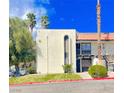 Inviting two-story condo featuring a private balcony and desert landscaping at 1440 Vegas Valley Dr # 1, Las Vegas, NV 89169