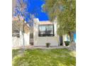 Charming two-story condo with a well-maintained lawn and mature trees at 1440 Vegas Valley Dr # 1, Las Vegas, NV 89169