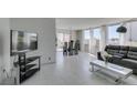 Bright and spacious open-concept living and dining space featuring stylish furnishings and large windows at 205 E Harmon Ave # 511, Las Vegas, NV 89169