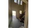 Bright foyer with high ceilings, hardwood floors, stairs, and natural light at 2409 W Gilmore Ave, North Las Vegas, NV 89032