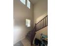 View of the staircase with blinds on the window at 2409 W Gilmore Ave, North Las Vegas, NV 89032