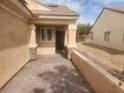 View of an outdoor sitting area in between two homes with paver flooring at 2704 Willow Wren Dr, North Las Vegas, NV 89084
