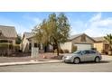 Inviting single-story home with a two-car garage and desert landscaping in a peaceful neighborhood at 5127 Fiji Island Ct, North Las Vegas, NV 89031
