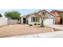 Attractive single-story home with low maintenance landscaping, convenient two-car garage, and inviting curb appeal at 5954 Rose Sage St, North Las Vegas, NV 89031