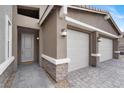 Attractive single-story home with a three-car garage and stone veneer accents at 6261 Lamont Hills Ave, Las Vegas, NV 89139
