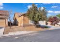 Single story home with desert landscaping and attached two car garage at 3792 Calle De Rio Ave, Las Vegas, NV 89115
