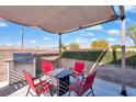 Covered outdoor patio with a built in BBQ and seating area perfect for entertaining at 3792 Calle De Rio Ave, Las Vegas, NV 89115