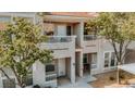 Charming multi-story condo boasts a private balcony and well-maintained front entrance in a desirable neighborhood at 10001 Peace Way # 2269, Las Vegas, NV 89147