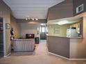 Open-concept living room with a view into the kitchen, featuring modern neutral walls and furnishings at 10001 Peace Way # 2269, Las Vegas, NV 89147