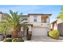Inviting two-story home featuring a desert landscape and balcony at 10505 Howling Coyote Ave, Las Vegas, NV 89135
