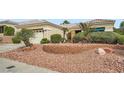 Well-maintained house with low-maintenance landscaping and decorative brickwork at 10800 Brinkwood Ave, Las Vegas, NV 89134