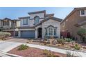 Charming two-story home featuring stone accents, a two-car garage, and desert landscaping in a well-maintained neighborhood at 1136 Jamesbury Rd, Las Vegas, NV 89135